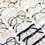 Glasses, Eyeglasses Optical Store, Fashion eyewear at night market, Colorful glasses, Glasses on shelf, Glasses in optical store shopping mall (Selective Focus)